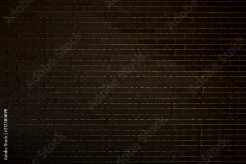Dark brick wall with light mortar. Texture background