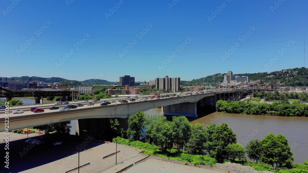 A slow push forward aerial establishing shot of Pittsburgh's Veterans Bridge over the Allegheny River on a sunny summer day. A slow push forward aerial establishing shot of Pittsburgh's Veterans Bridge over the Allegheny River on a sunny summer day.