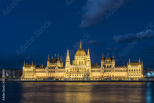 The palace of Parliament in front of Danube river at dusk in Budapest, Hungary