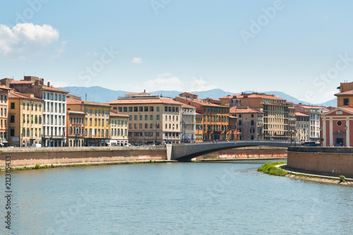 Arno River on sunny day in Pisa, Italy