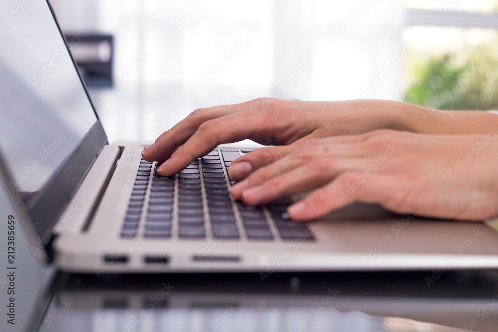 Woman with the hands over the laptop keyboard. Woman with the hands over the laptop keyboard.