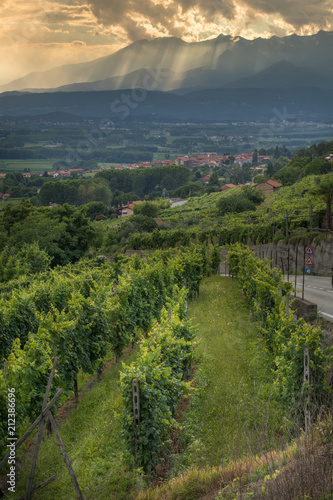 Sun filtering through the clouds over the Canavese Mountains in Piedmont Italy