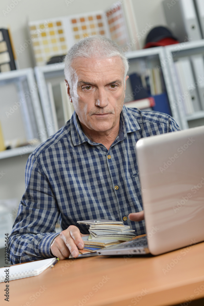 Senior office worker at his desk Senior office worker at his desk