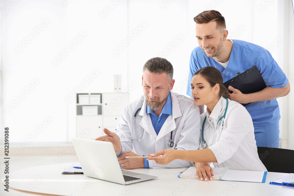 Group of doctors attending meeting in clinic. Cardiology conference Group of doctors attending meeting in clinic. Cardiology conference