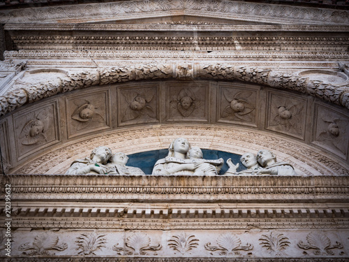 Detail of the carved facade of an Italian medieval church.