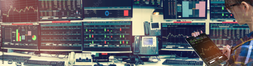 Double exposure of business woman holding blank tablet for Stock market quotes and chart in monitor computer room with business office equipments .business and money trading concept,panorama photo Double exposure of business woman holding blank tablet for Stock market quotes and chart in monitor computer room with business office equipments .business and money trading concept,panorama photo