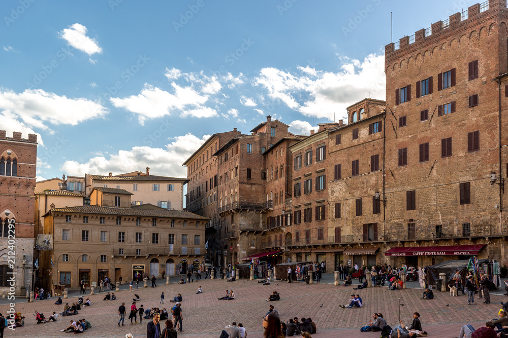 Square corner with medieval buildings in Siena, Italy