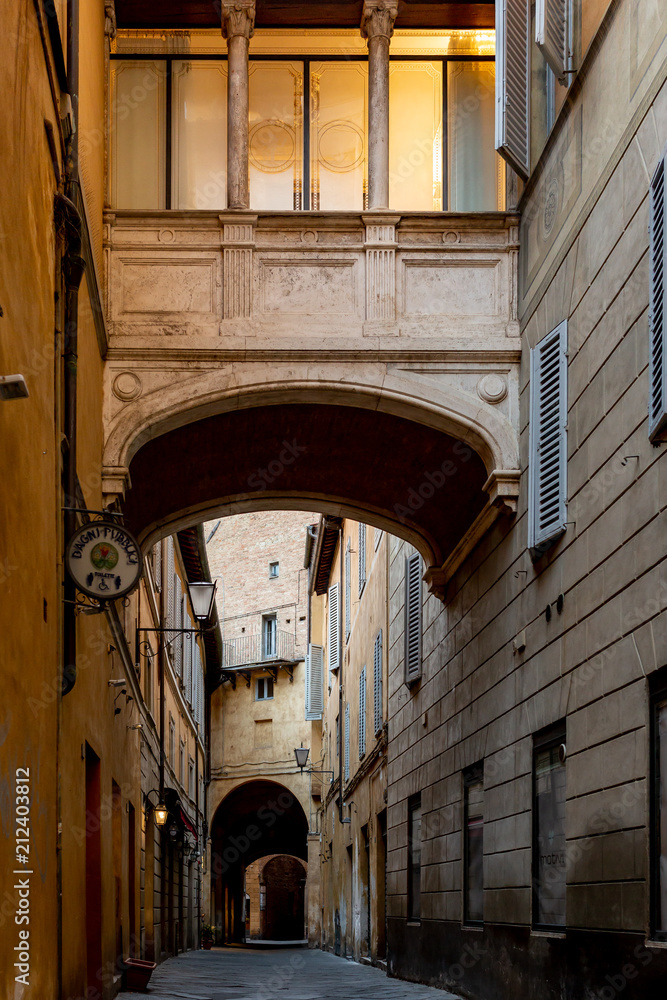 Street archway in medieval city of Siena in Italy
