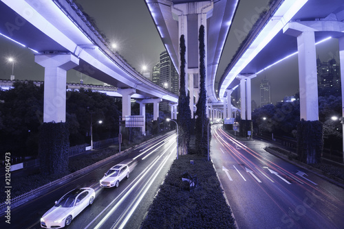 Night scene of asphalt road and modern bridge