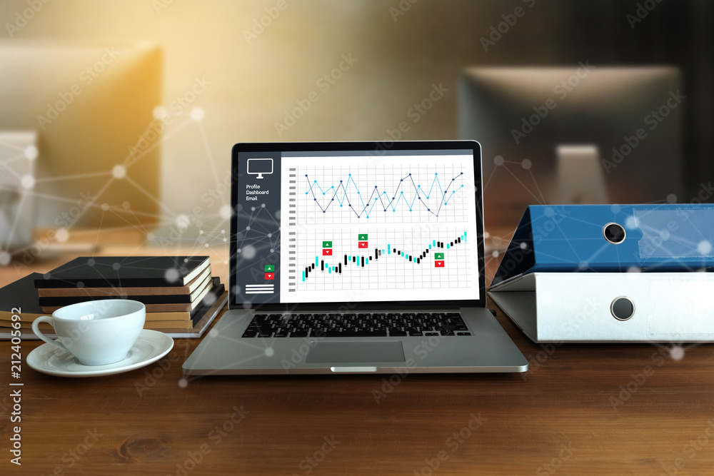 DIGITAL MARKETING new startup project MILLENNIALS Business team hands at work with financial reports and a laptop DIGITAL MARKETING new startup project MILLENNIALS Business team hands at work with financial reports and a laptop