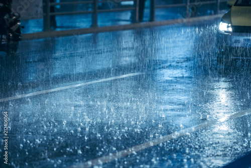 Foto Cars driving on wet road in the rain with headlights