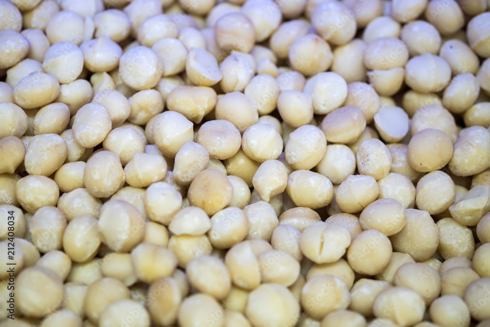 Backround of new harvest Macadamia nuts for sale at the city market Backround of new harvest Macadamia nuts for sale at the city market