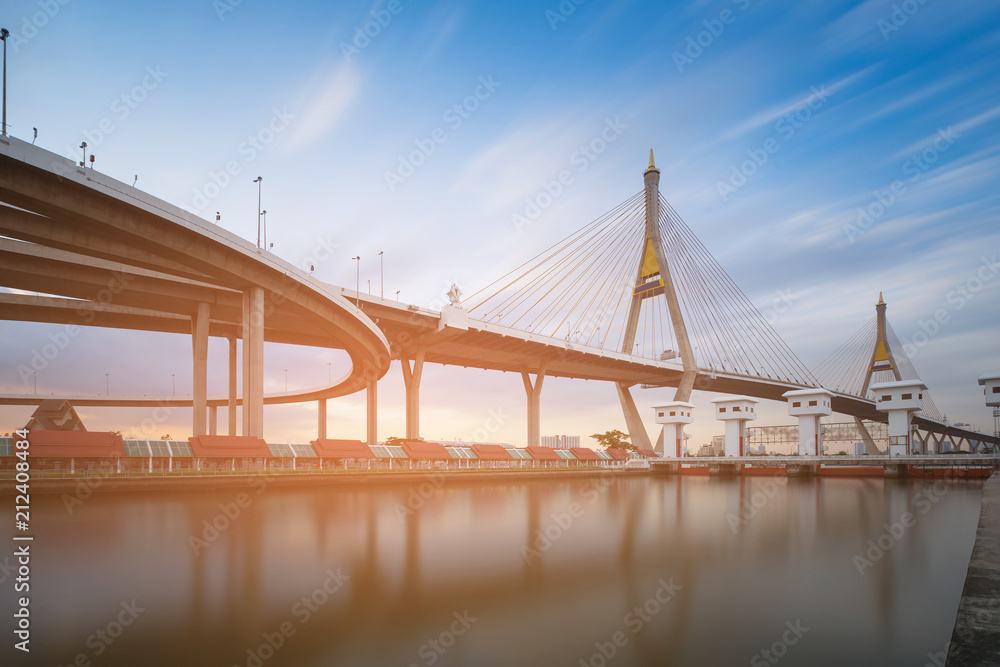 Obraz premium Twin suspension bridge reflection water front, highway transportation background