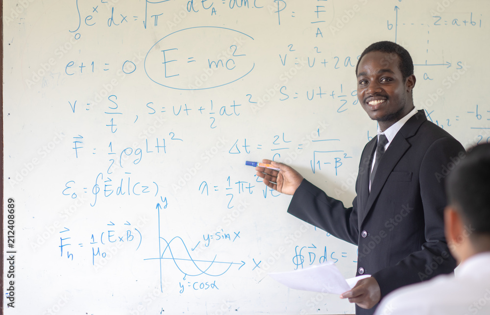 African science teacher teaching in the classroom. African science teacher teaching in the classroom.