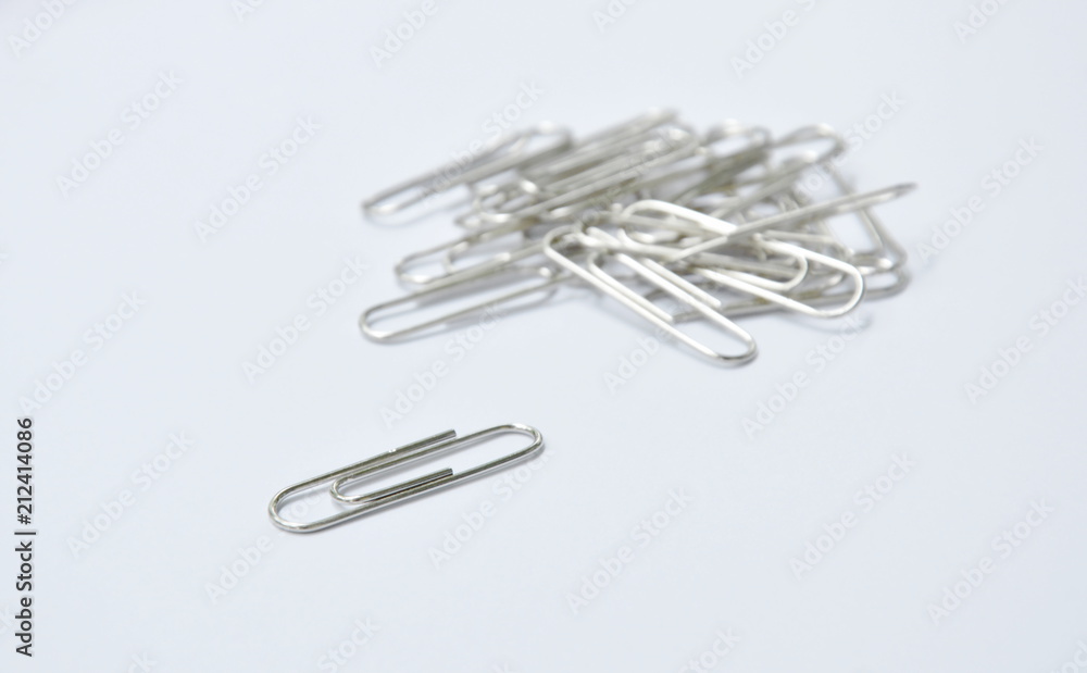 silver paper clip on white background silver paper clip on white background