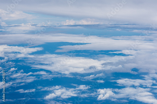 cloud and blue sky view from window of airplane