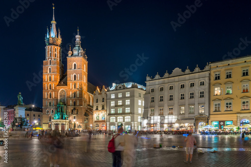 beautiful square of Krakow twilight, view of the Church of Mary