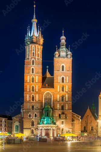 night view of the market square and the church in the center of Krakow