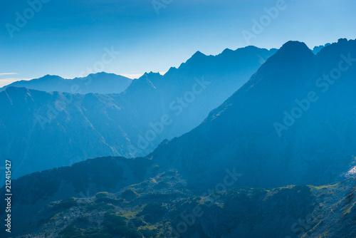 high beautiful mountains of the Tatra in the haze on a sunny day, landscape © kosmos111