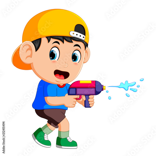 Boy playing with water gun