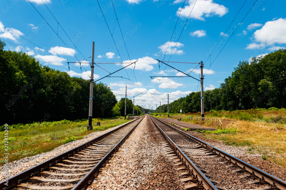 Scenic railroad in rural area and blue sky with white clouds in summer Scenic railroad in rural area and blue sky with white clouds in summer