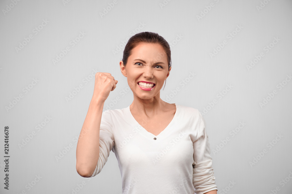 Happy winner. success business woman celebrating screaming and dancing of joy winning. Beautiful Caucasian businesswoman cheerful for her succes Isolated on white background Happy winner. success business woman celebrating screaming and dancing of joy winning. Beautiful Caucasian businesswoman cheerful for her succes Isolated on white background