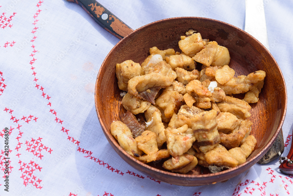 pork cracklings in wooden bowl,serbian cvarci pork cracklings in wooden bowl,serbian cvarci