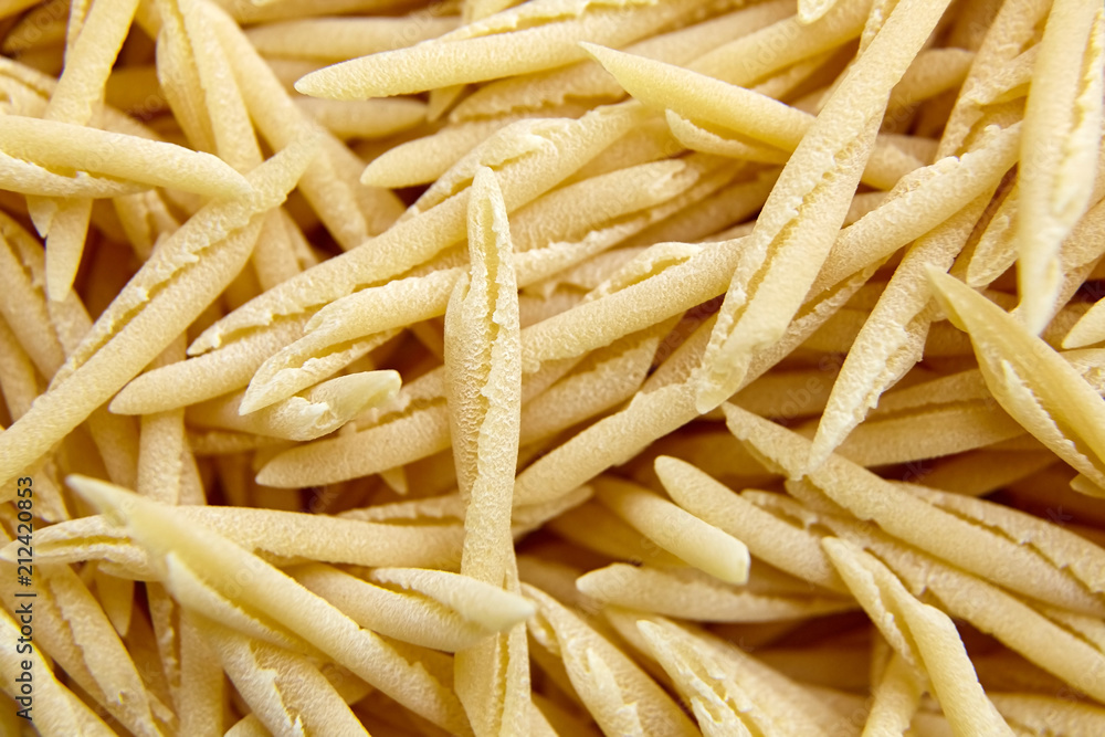 Dry Uncooked Trofie Italian Pasta . Food Background Dry Uncooked Trofie Italian Pasta . Food Background