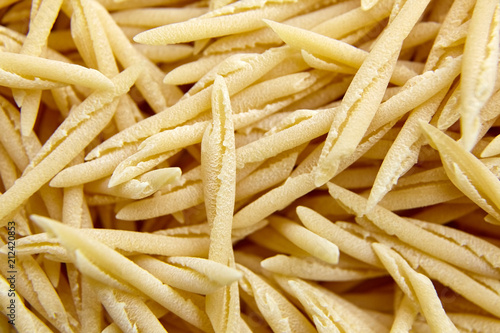 Photos Dry Uncooked Trofie Italian Pasta . Food Background