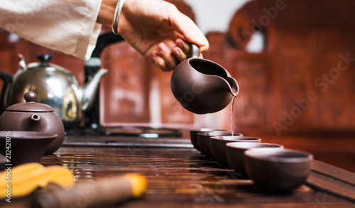 Tea ceremony, Woman pouring traditionally prepared Chinese tea
