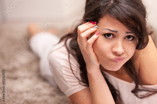 sad or worried woman in a funny expression