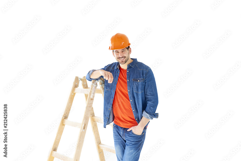 Young handyman with ladder. Portrait of handsome construction worker with his ladder standing at isolated white background with copy space. Young handyman with ladder. Portrait of handsome construction worker with his ladder standing at isolated white background with copy space.