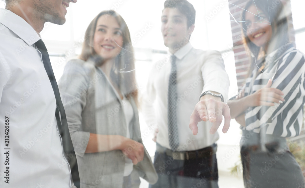 Obraz premium from behind the glass.business team in the officce