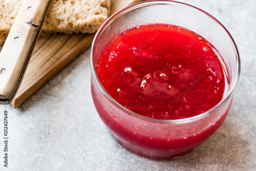Red Plum Marmalade Jam with Bread and in glass Bowl. Red Plum Marmalade Jam with Bread and in glass Bowl.