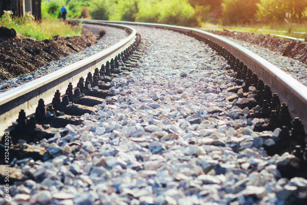 Railway rails close up in the rays of the setting sun. Railway rails close up in the rays of the setting sun.