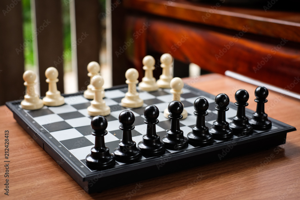 Chess white pawn invade (attack) black pawn for leader background or texture - Business & Strategy Concept. Chess white pawn invade (attack) black pawn for leader background or texture - Business & Strategy Concept.