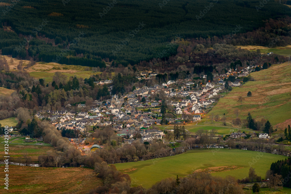 View of the village of Killin in Scotland at dusk from the Tarmachan ridge.