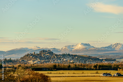 View of the Stirling Castle and the old town in winter with the mountains in the background.