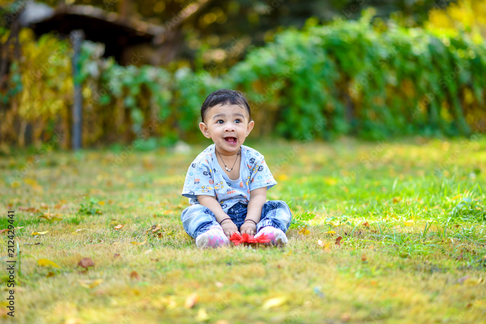 cute indian baby boy playing at garden cute indian baby boy playing at garden