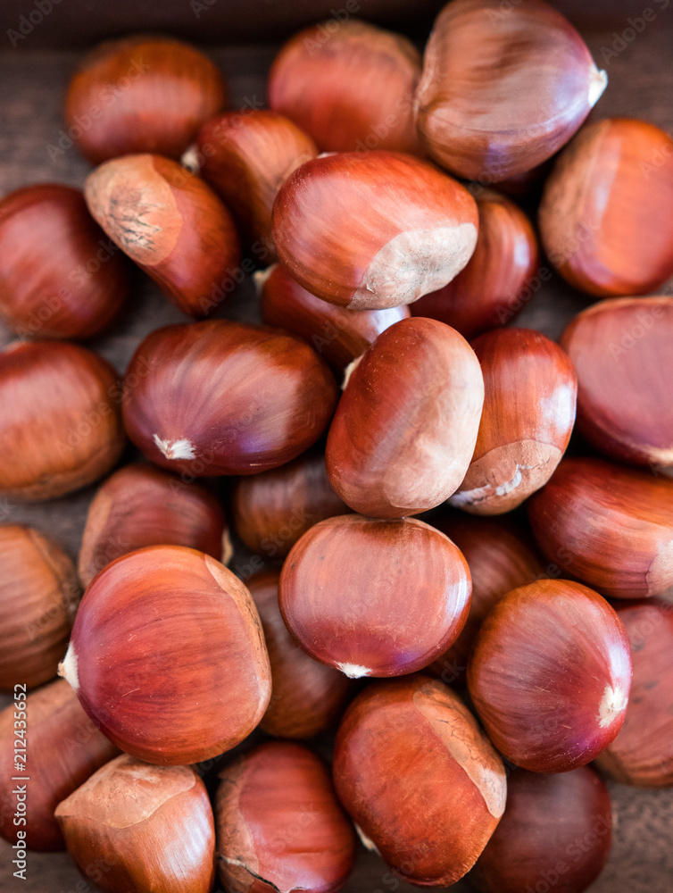Shiny and ripe chestnuts for Christmas. Fresh and sweet. Shiny and ripe chestnuts for Christmas. Fresh and sweet.