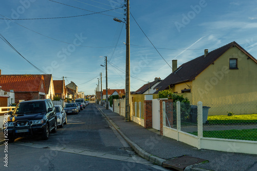 Country houses with fences and streets in the region of Normandy  France. Beautiful countryside  lifestyle and typical french architecture  european country landscapes