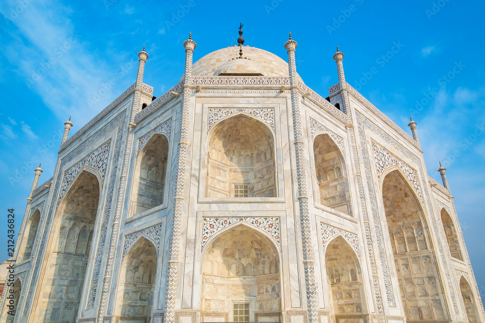 Taj Mahal on a sunny day. An ivory-white marble mausoleum on the south bank of the Yamuna river in Agra, Uttar Pradesh, India. One of the seven wonders of the world.