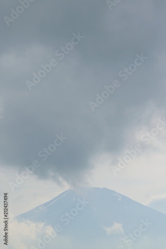 Landscape of Mount Fuji in Japan with rising clouds