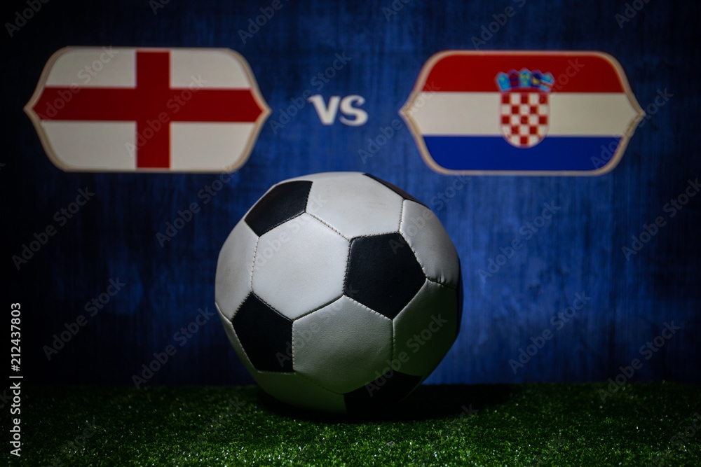 Soccer 2018. Creative concept. Soccer ball on green grass. England and Croatia. Soccer 2018. Creative concept. Soccer ball on green grass. England and Croatia.