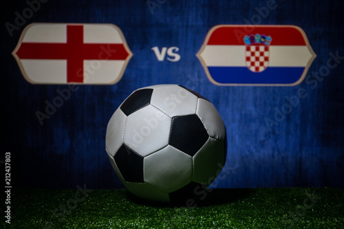 Soccer 2018. Creative concept. Soccer ball on green grass. England and Croatia.