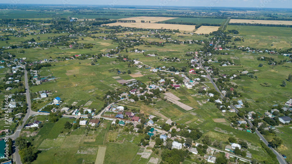 aerial view of a house in a scenic countryside hills on a sunny day