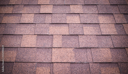 roof of new brown shingles background and texture. vignette