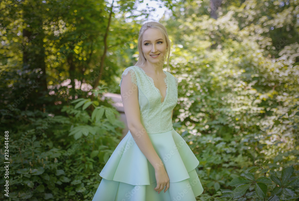 Summertime portrait of beautiful young woman. Selective focus. Summertime portrait of beautiful young woman. Selective focus.