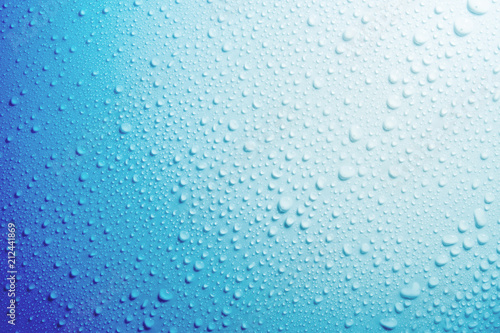 Water droplets on blue background.