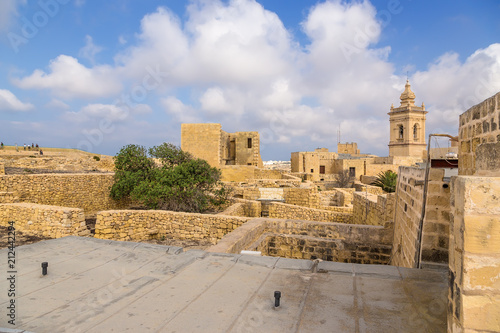 Victoria, the island of Gozo, Malta. The bell tower of the cathedral and the city buildings inside the Citadel